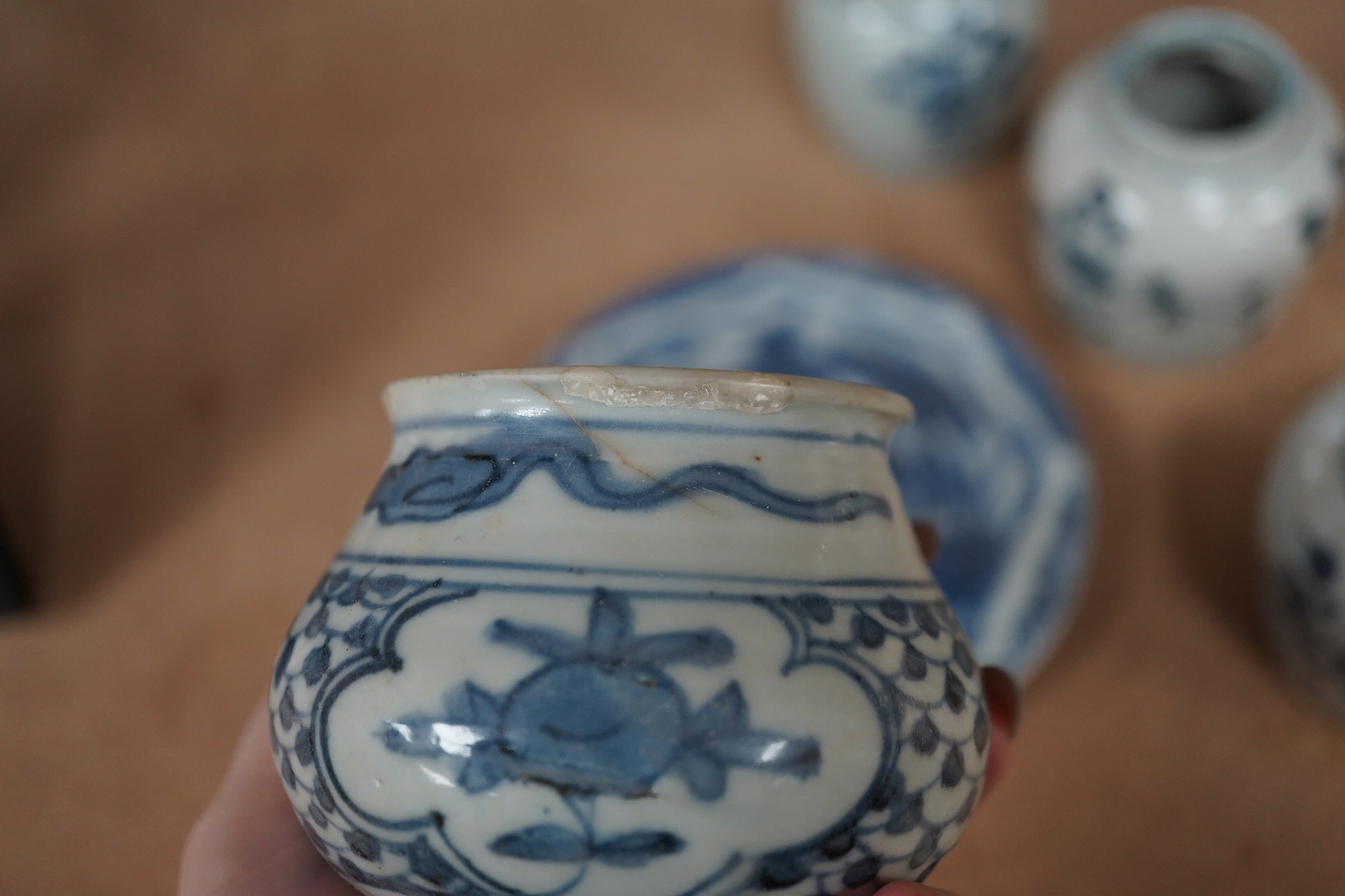 Three Chinese blue and white jars and a dish centre, late Ming dynasty, largest 13cm in diameter. Condition - fair